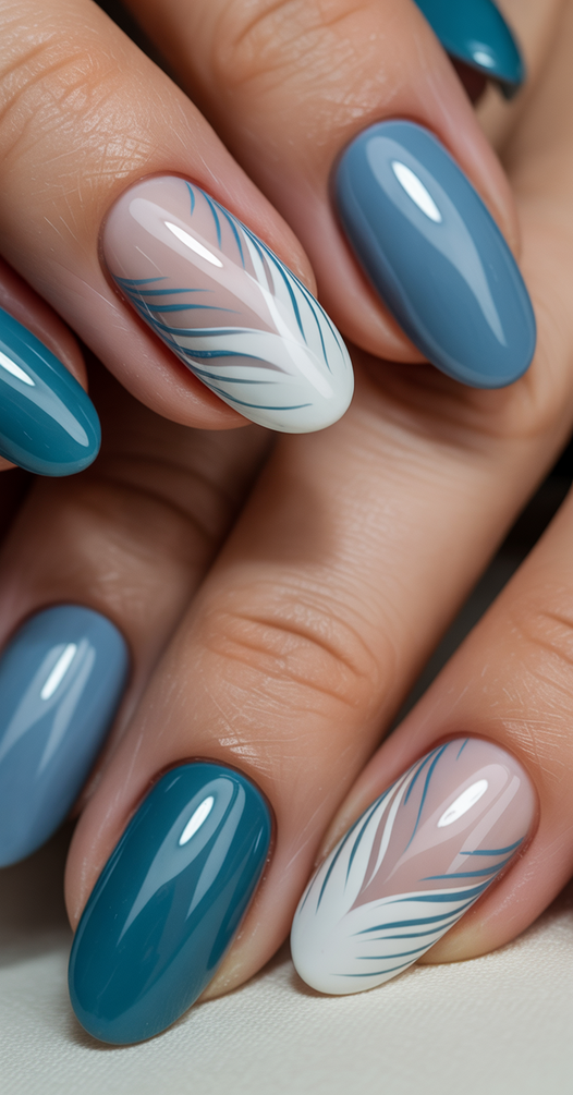 Blue nails with feather detailing.