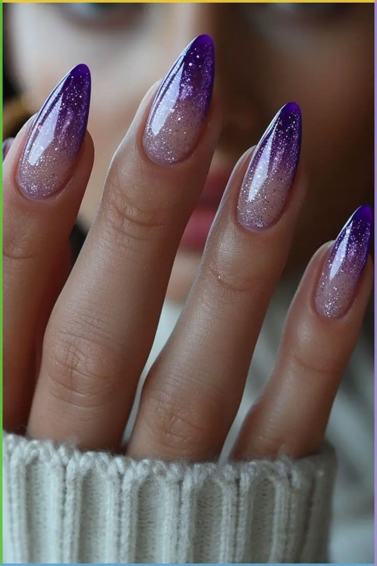 Purple ombre nails with glitter.
