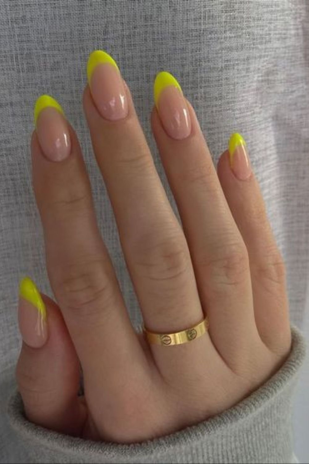 Neon yellow French tips on almond nails