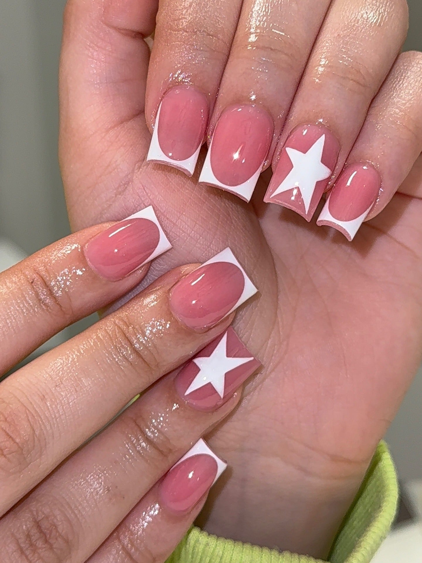Square nails with starry white French tips, playful and modern.