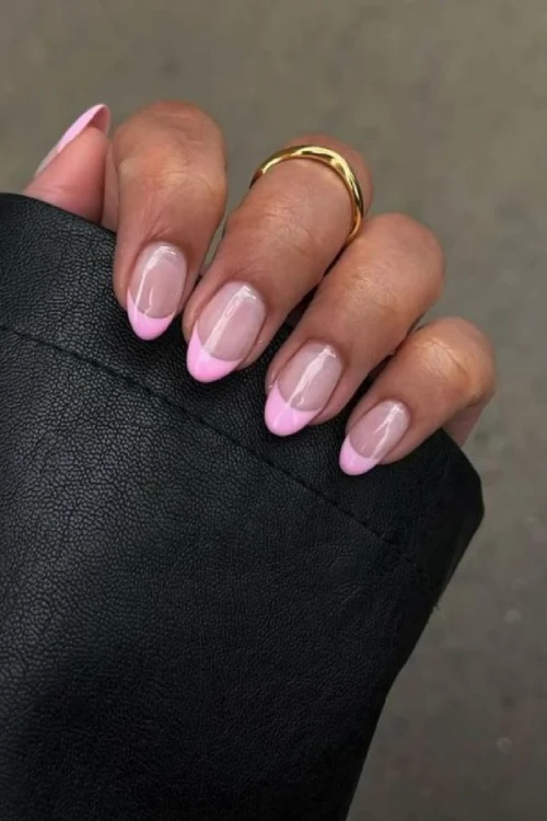 Almond-shaped nails with soft pink French tips, delicate and subtle.