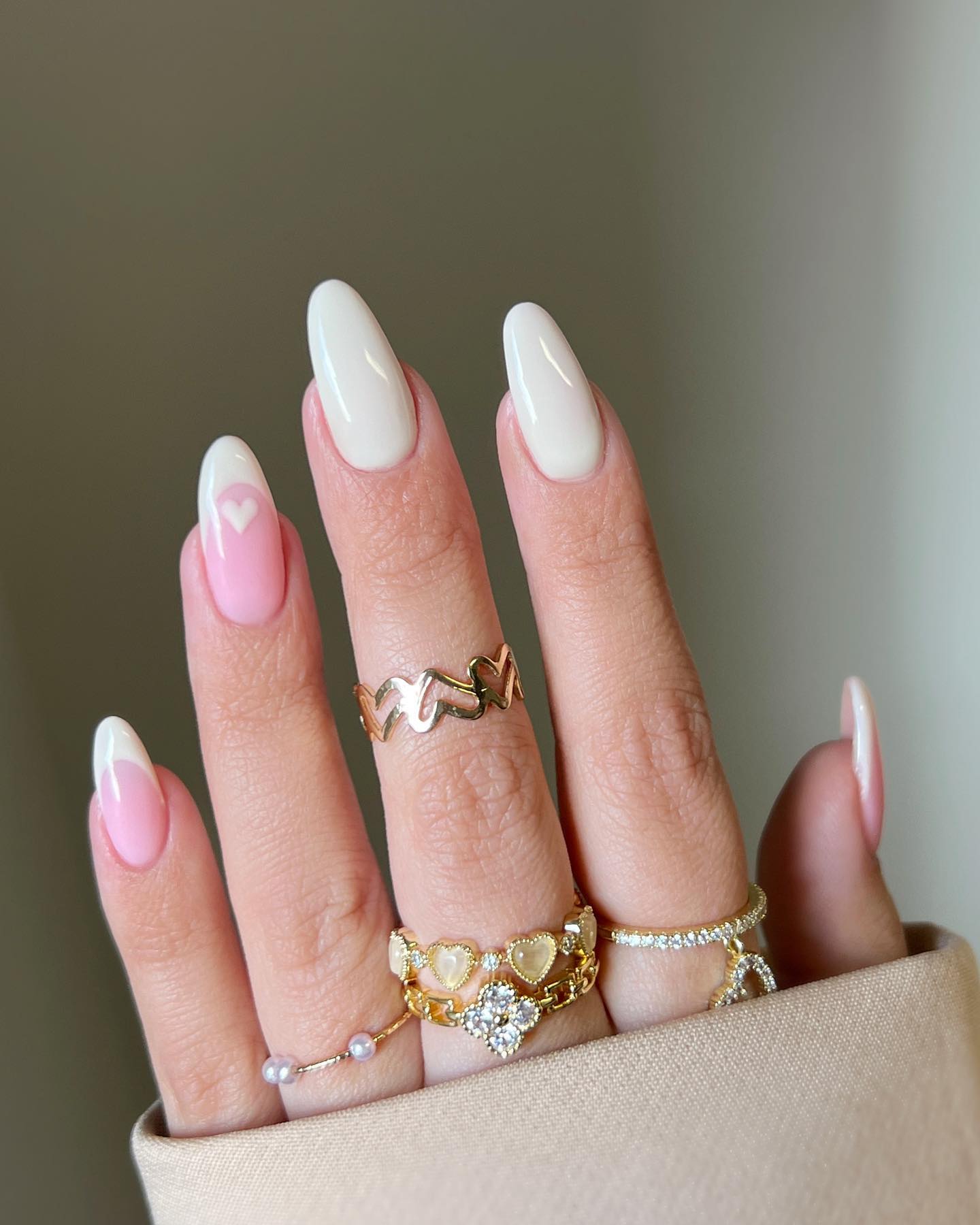 Minimal French tips with pink heart accent, elegant and sweet.