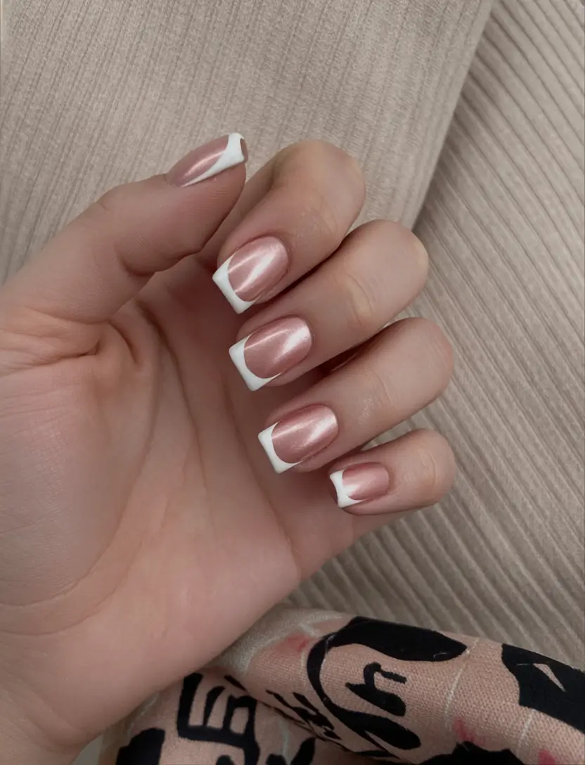 Metallic rosy nails with white tips, elegant and luminous.