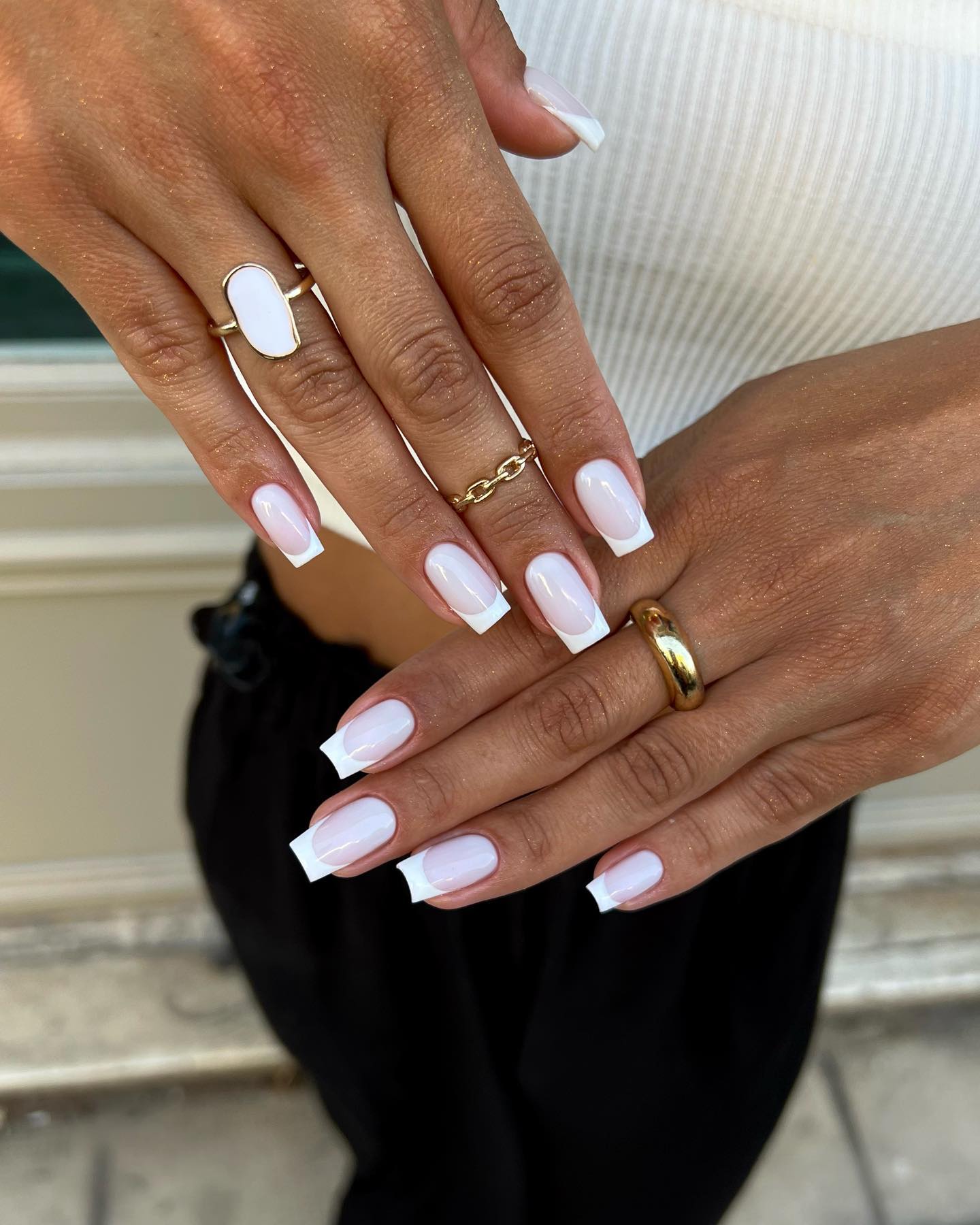 Classic French tips on square nails, timeless and elegant.