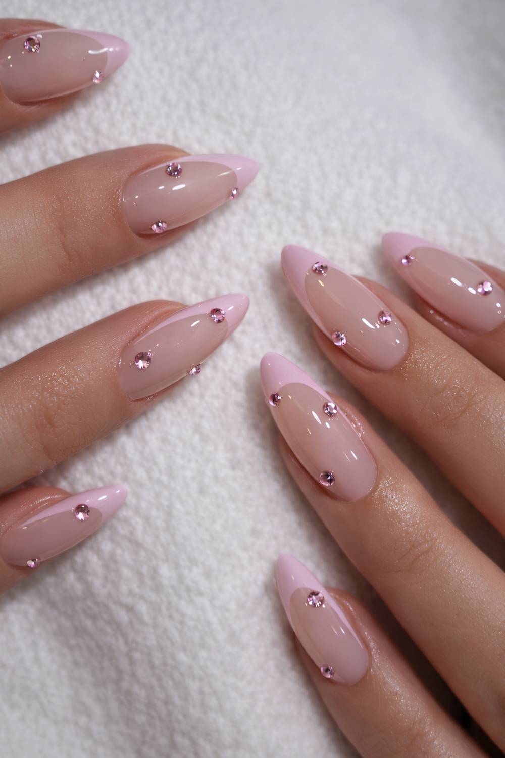 Pink jewels on almond nails, elegant and sophisticated.