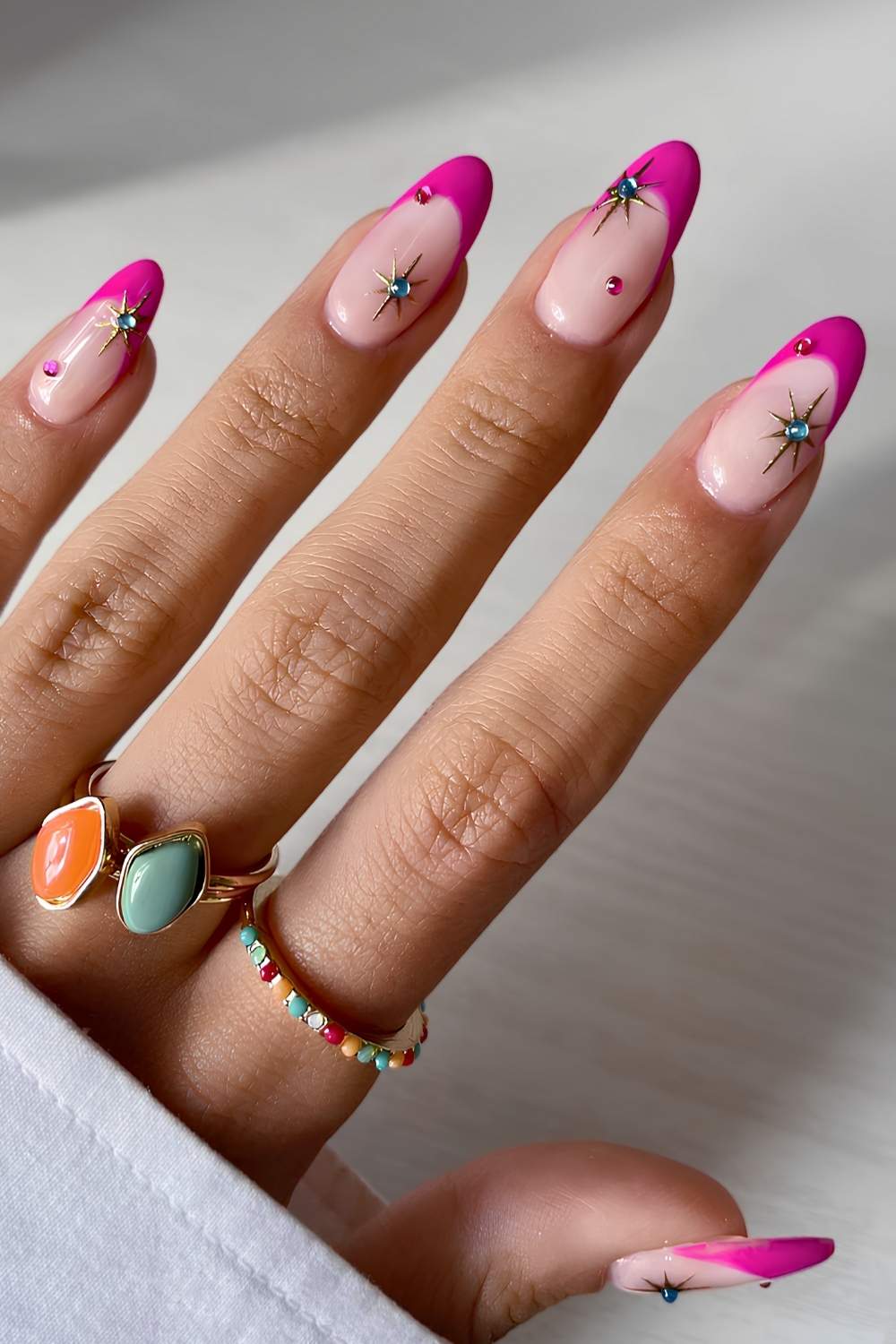 Fuchsia French tips with star accents, playful and bold.
