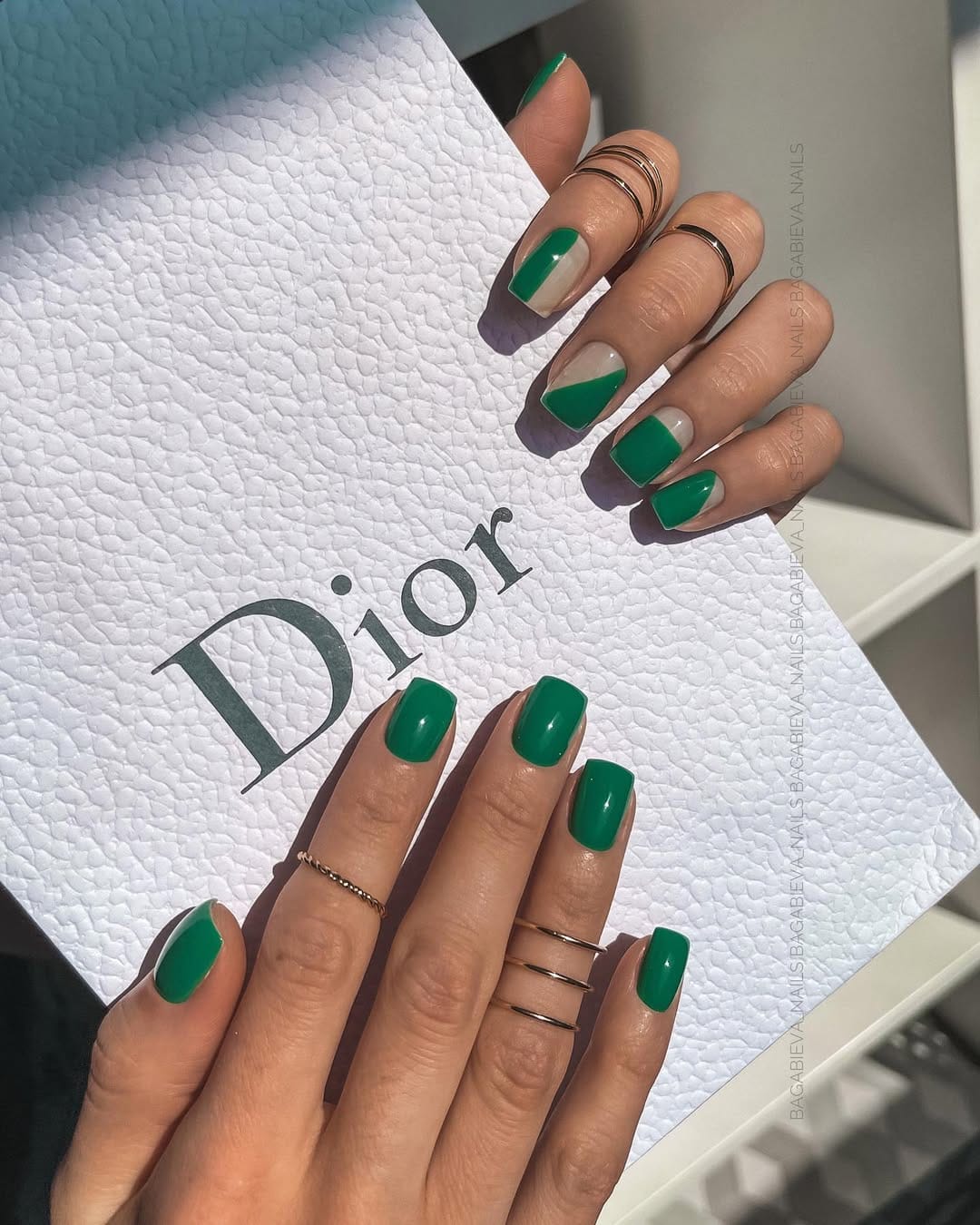 Glossy emerald green nails with a square shape