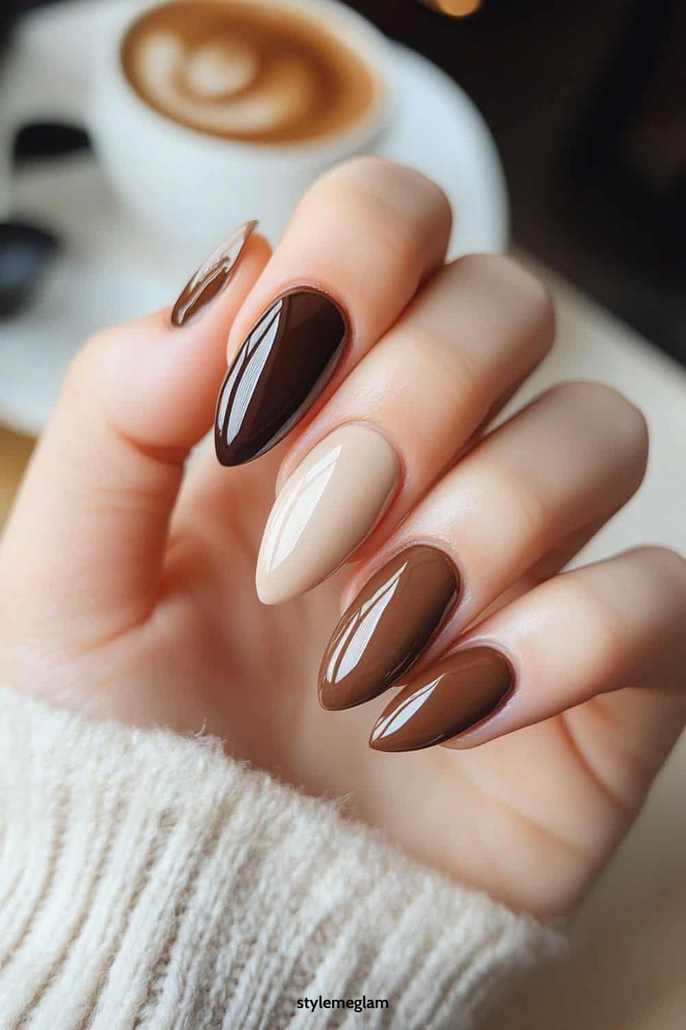 Various brown shades on almond nails, glossy finish