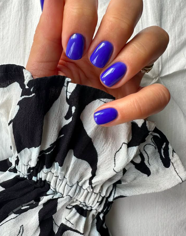 Cobalt blue nails with a glossy finish, striking and bold
