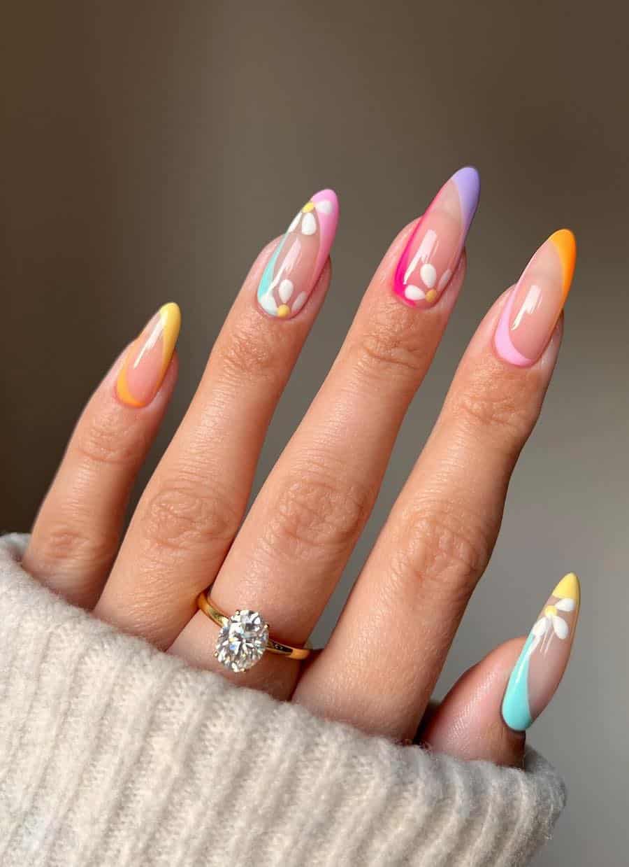 Pastel ombre nails with daisy accents