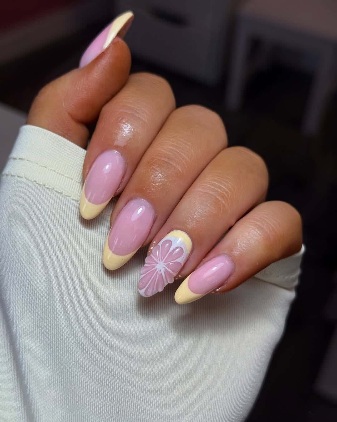 Soft pink nails with yellow French tips