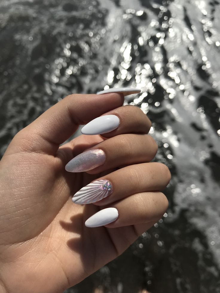 White nails with pearlescent and shell accents