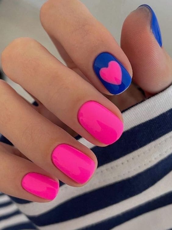 Hot pink and blue nails with heart design