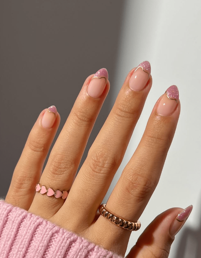 Pink nails with glitter French tips