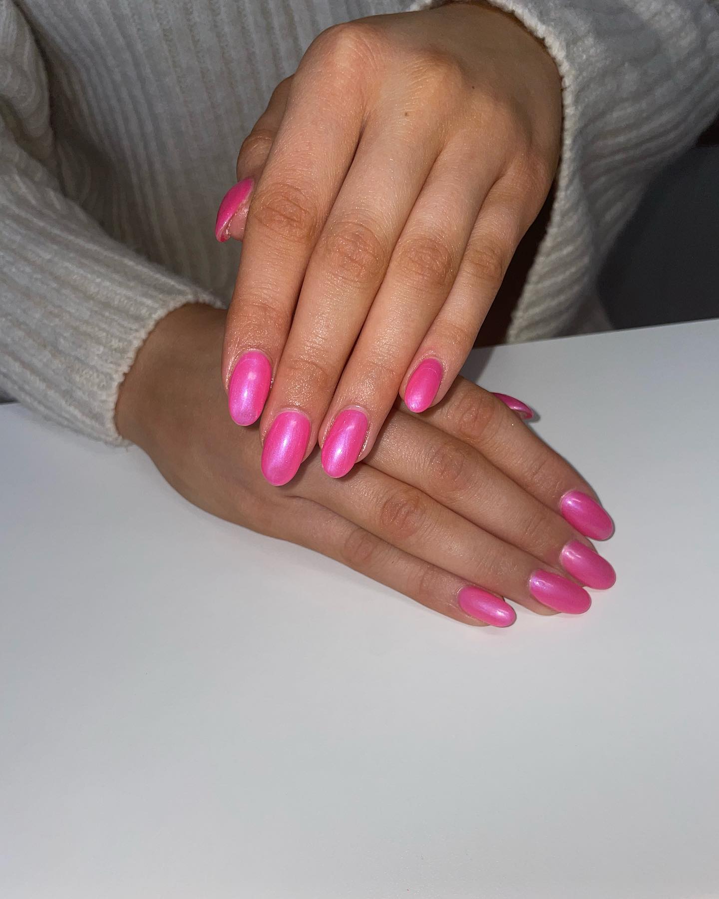 Shimmering pink nails with glossy finish