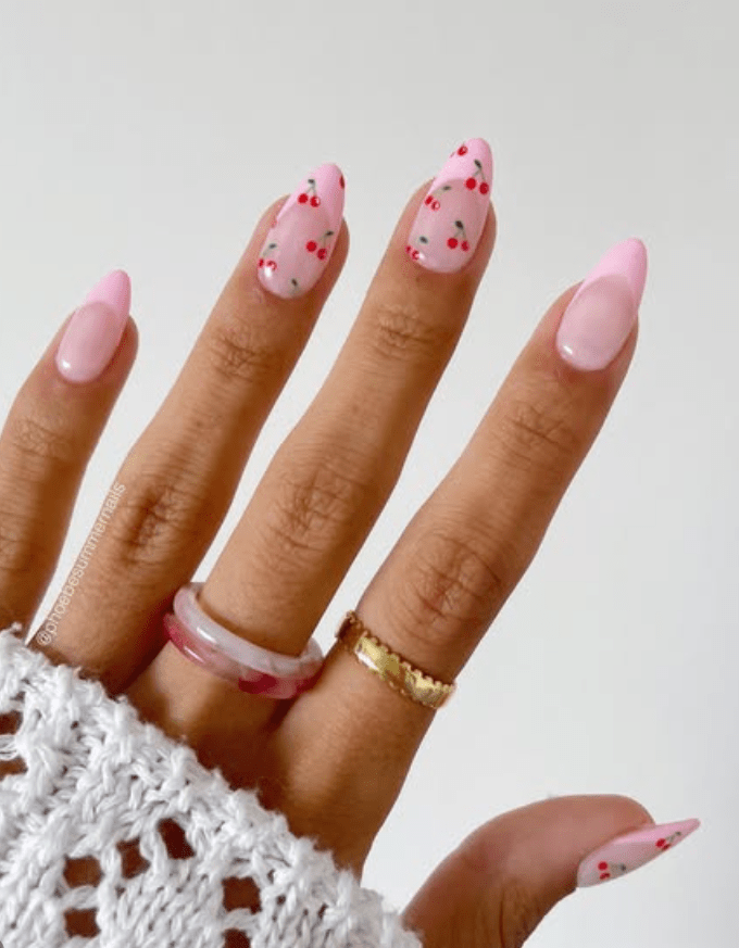 Pastel pink nails with polka dots