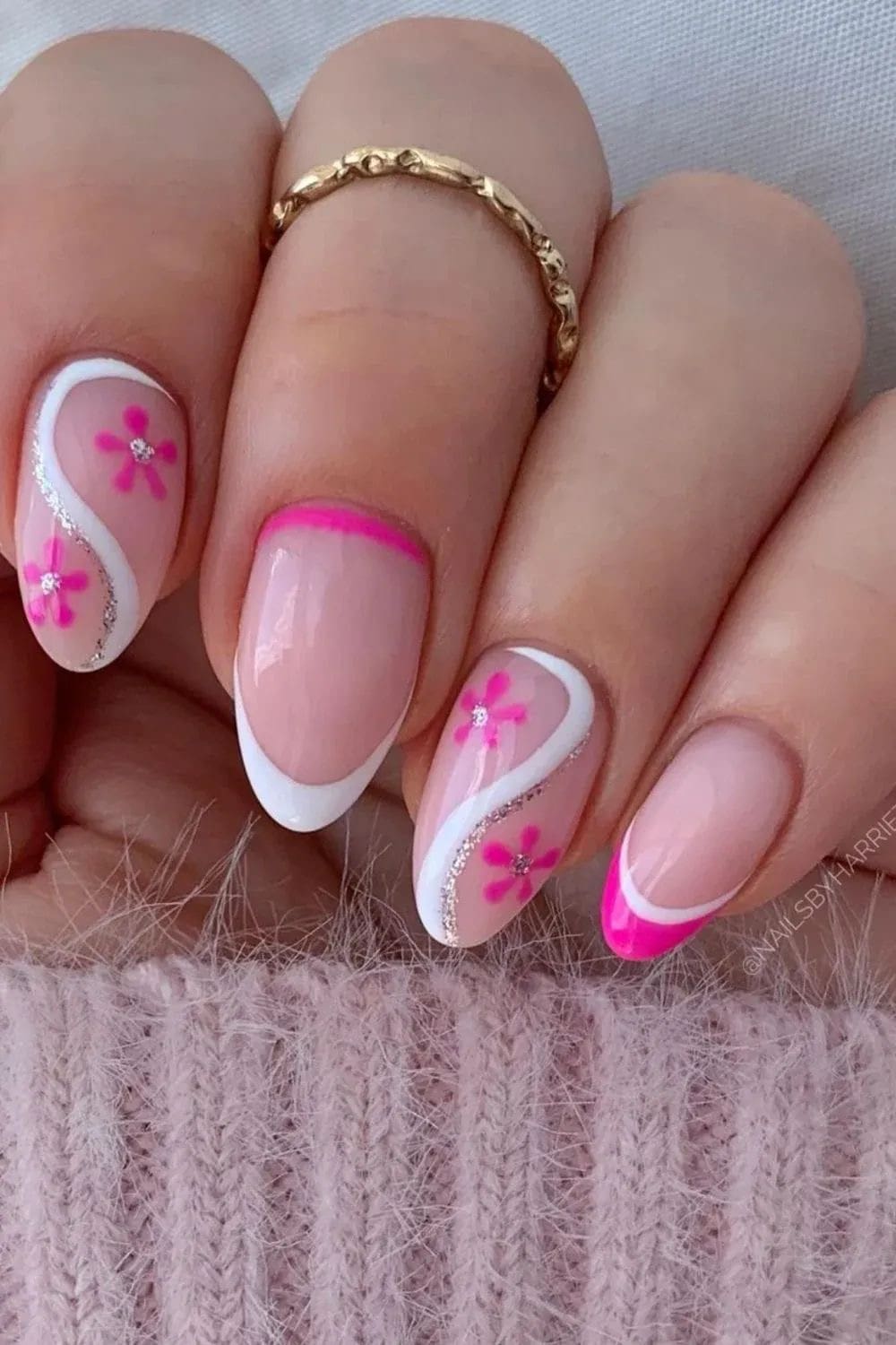 Floral French nails with pink accents