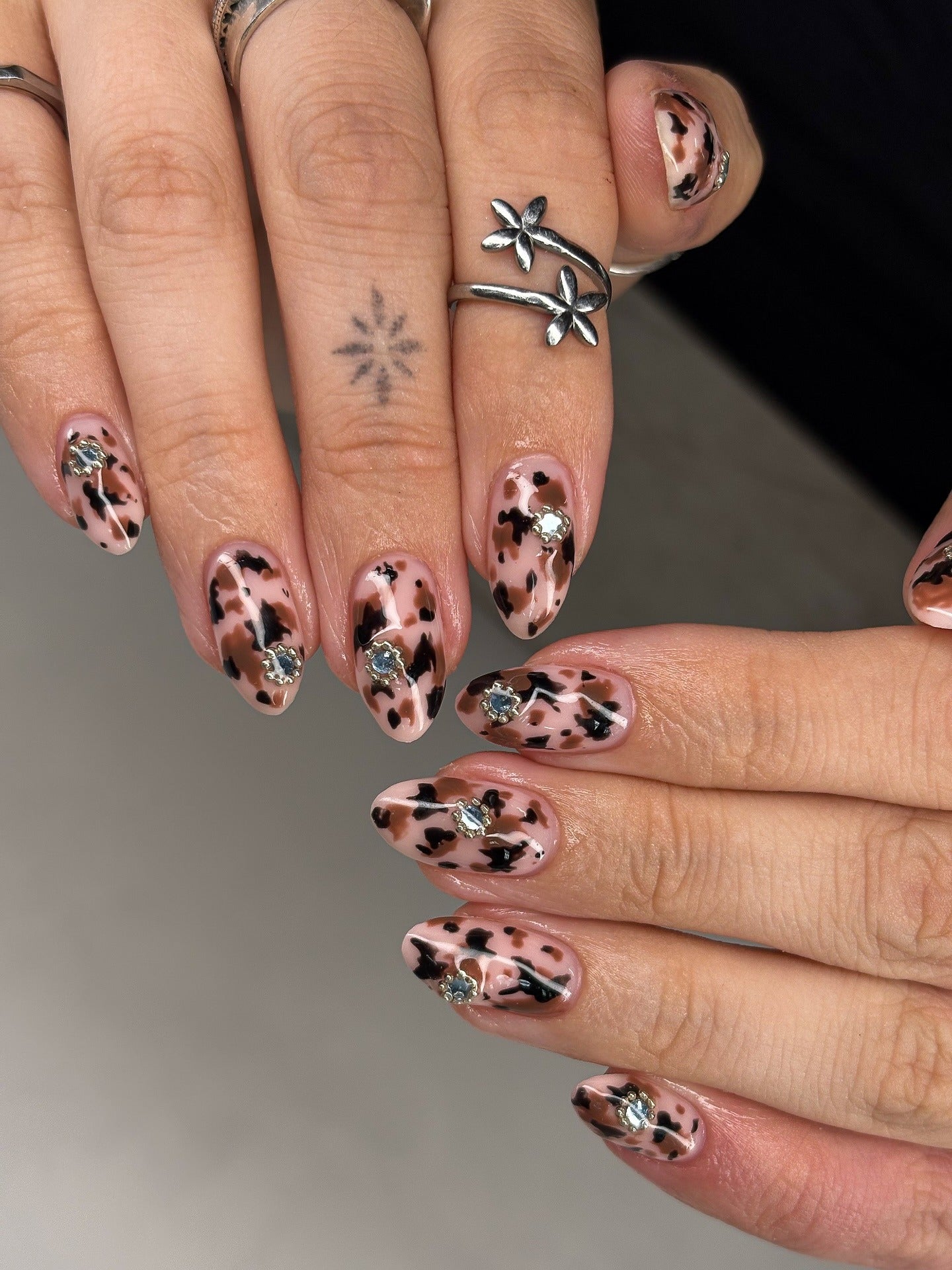 Gem-studded leopard nails, chic design, Pinterest style