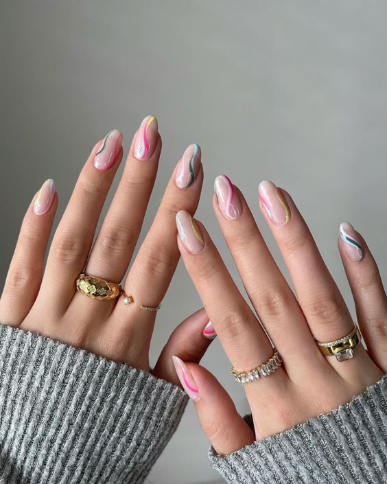 Pastel swirl nails, combining soft colors with playful designs for a whimsical effect.