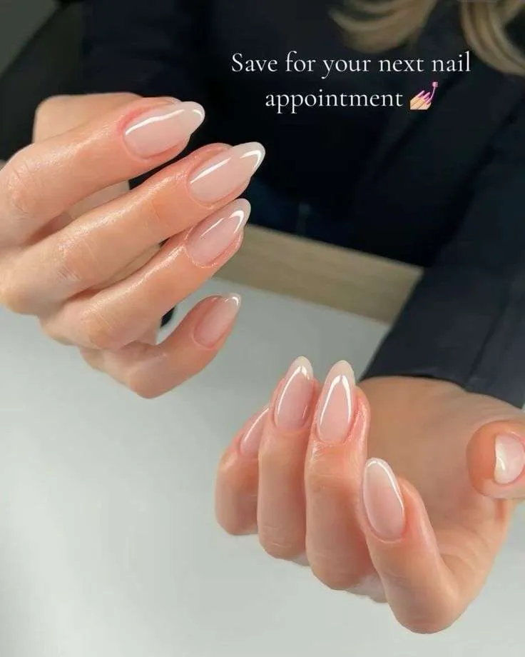 Elegant soft pink tipped nails, chic and subtle.