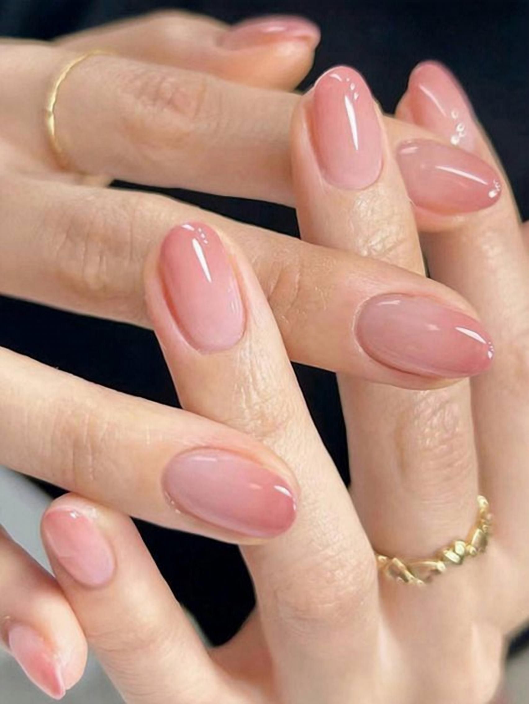 Glossy pink almond nails, chic and versatile.