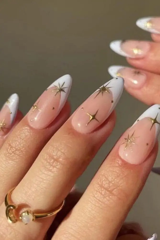 Celestial star nail accents, ethereal design.