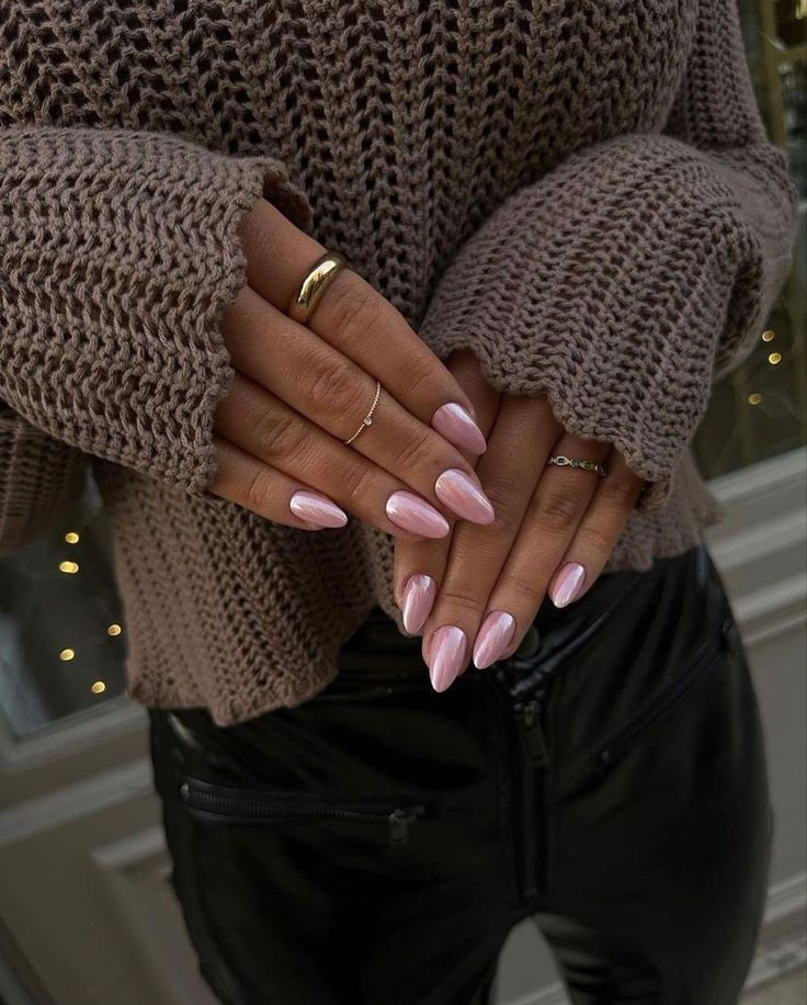 Soft pink iridescent nails, ethereal glow.