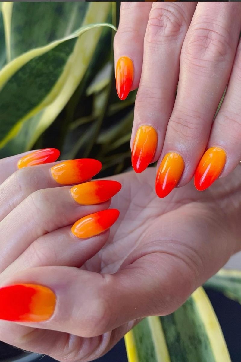 Orange ombre nails with gradient effect