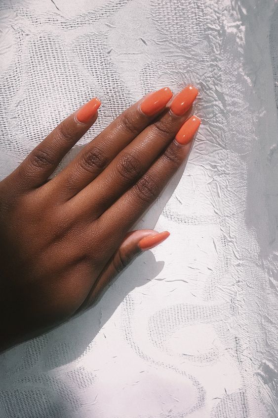 Simple orange nails on medium length