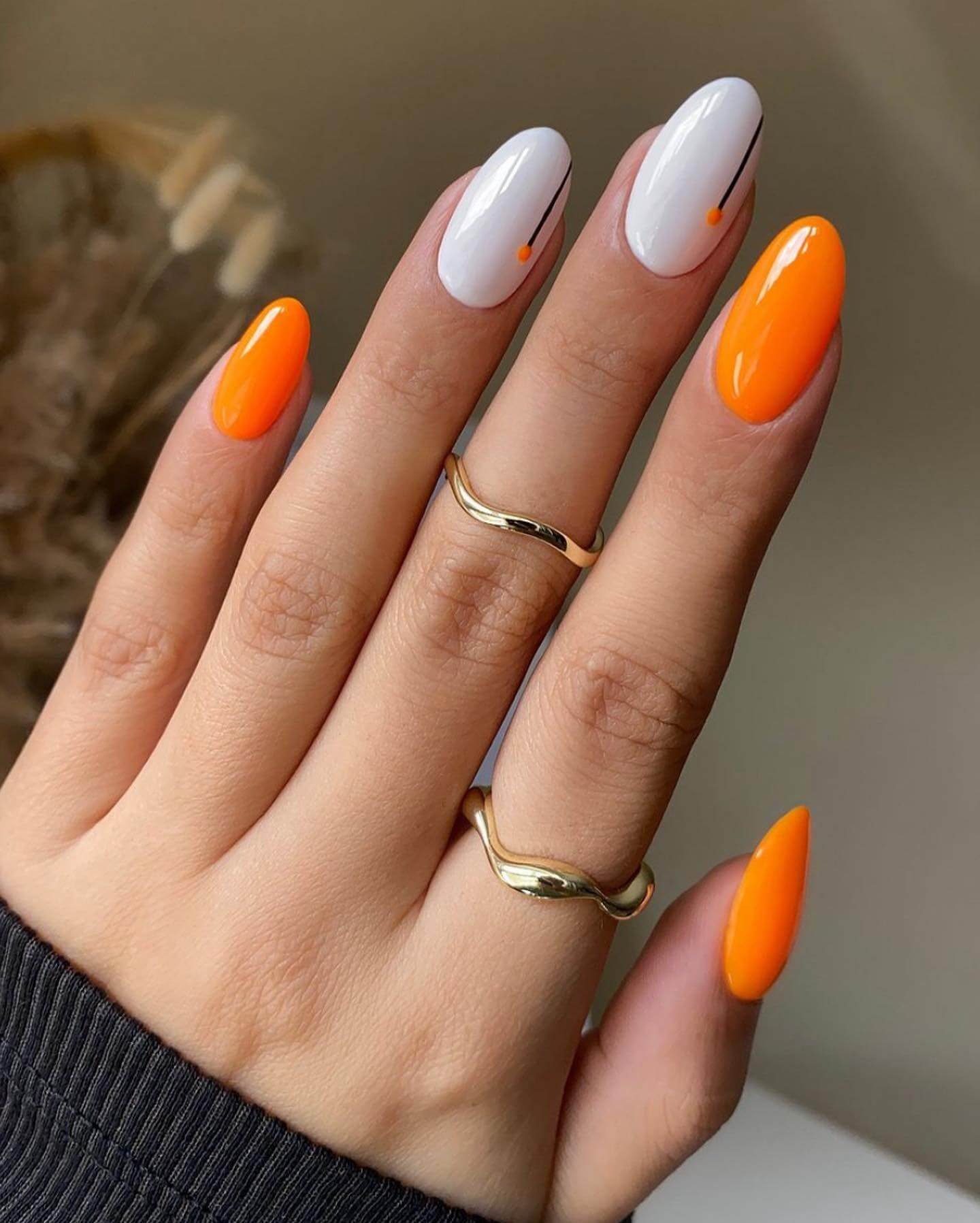Orange and white nails with line art