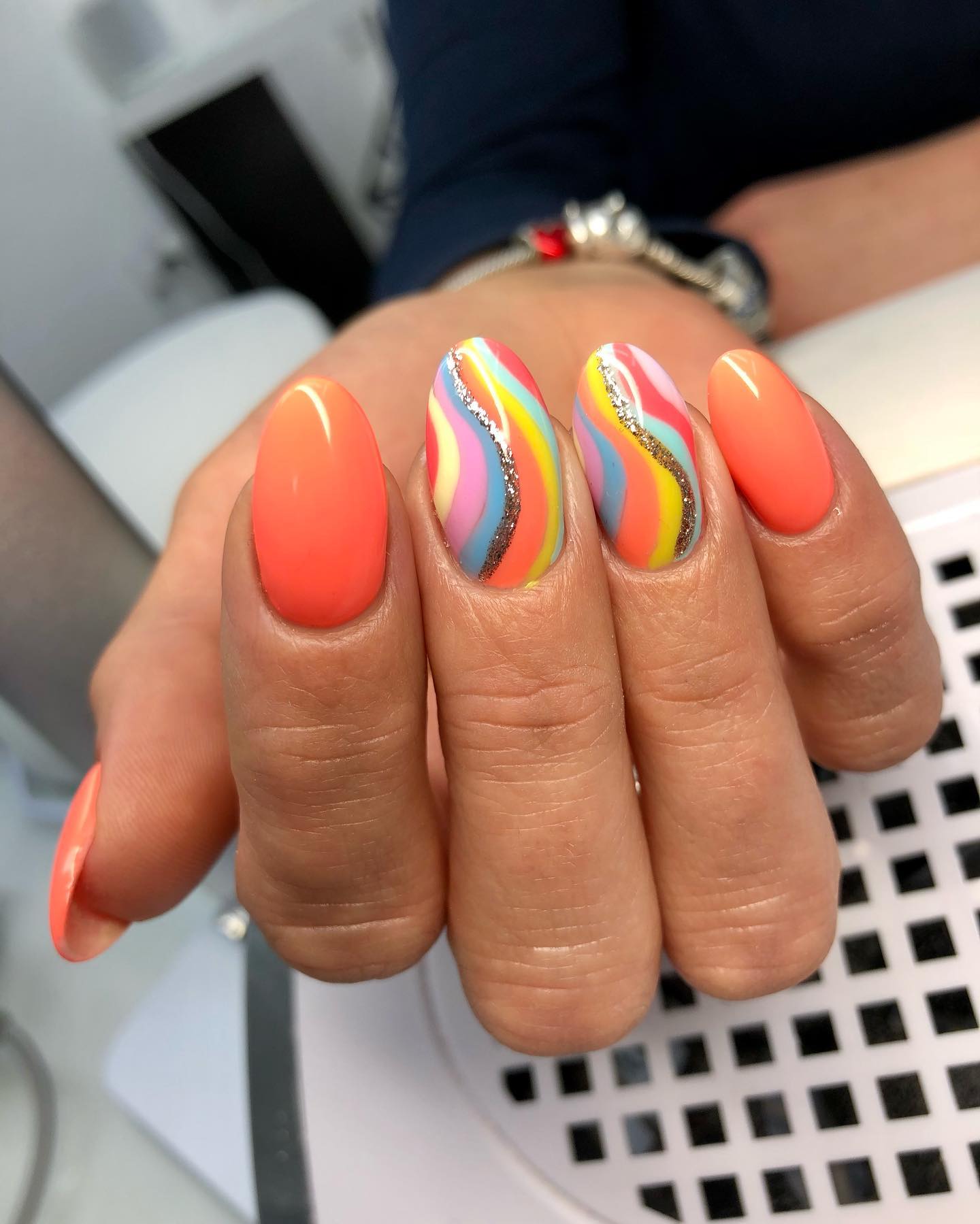 Orange and multicolor wave nail design