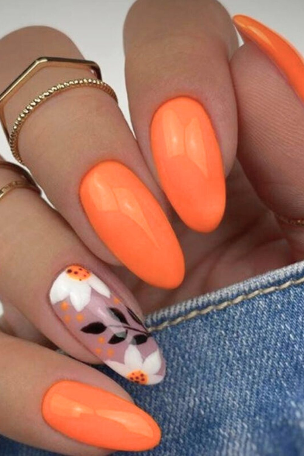 Orange nails with floral accent nail