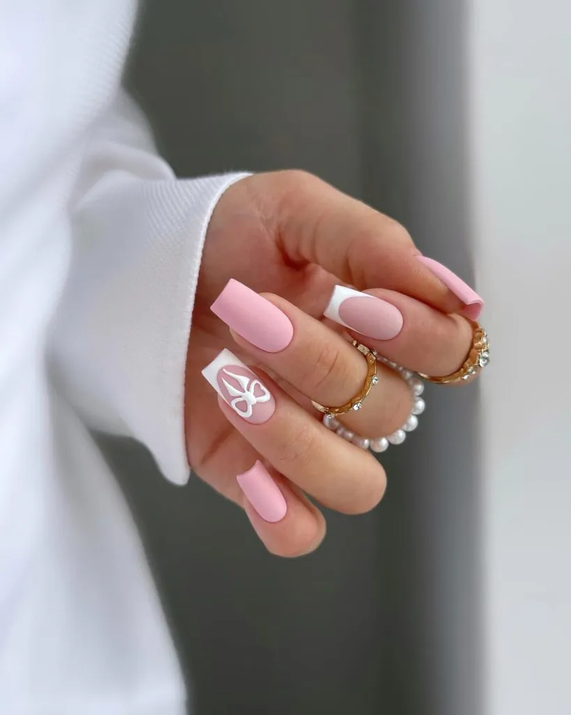Square pink nails with white geometric detail, modern manicure