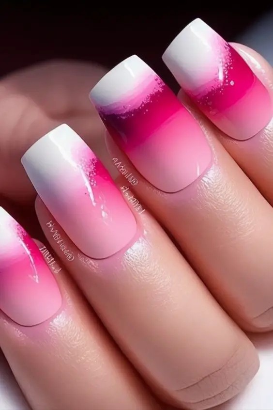 Square pink and white ombre nails with artistic flair, creative nail art