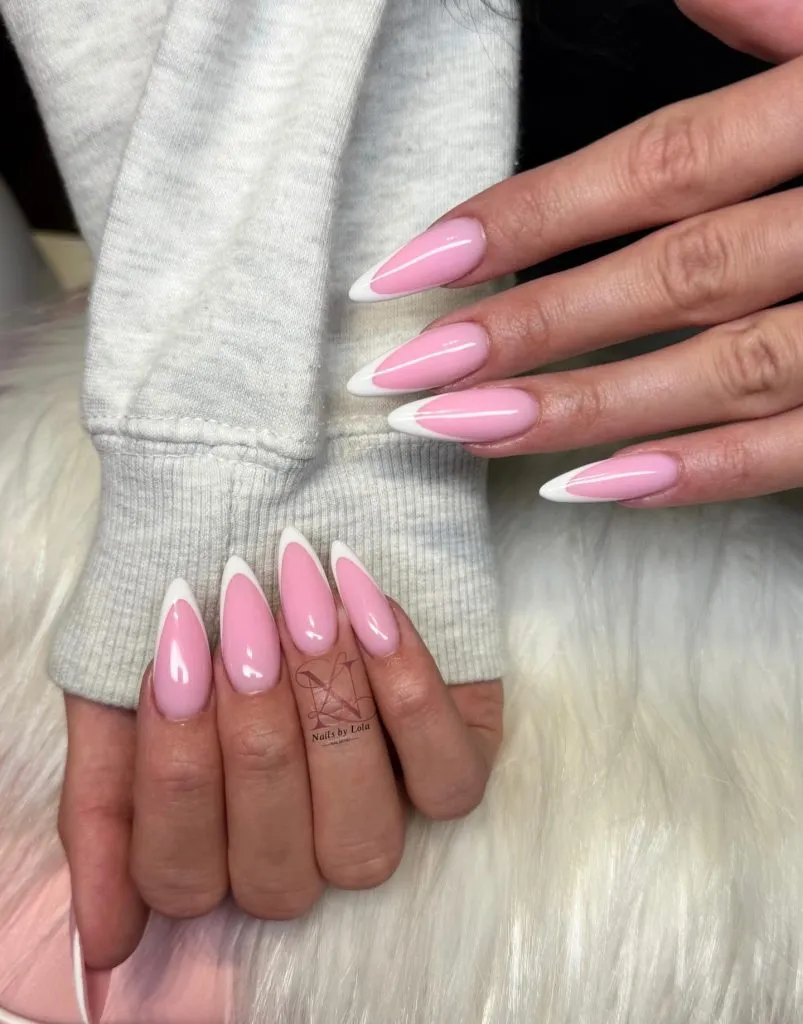 Almond-shaped pink and white ombre French nails, elegant manicure