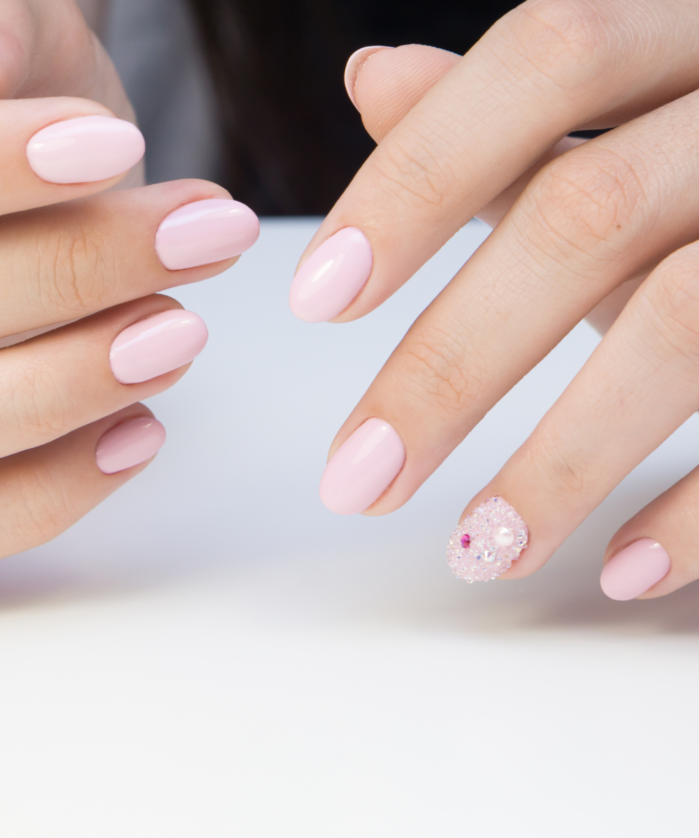 Soft pink nails with pearl embellishments and Pinterest elegance.