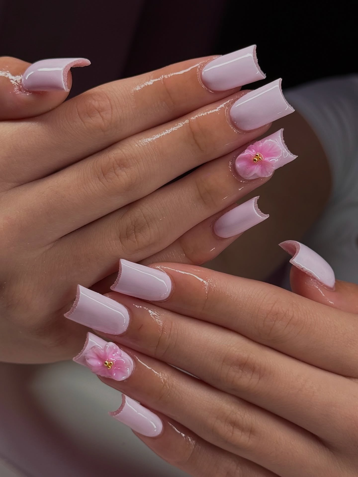 Soft pink nails with floral accents, Pinterest chic.