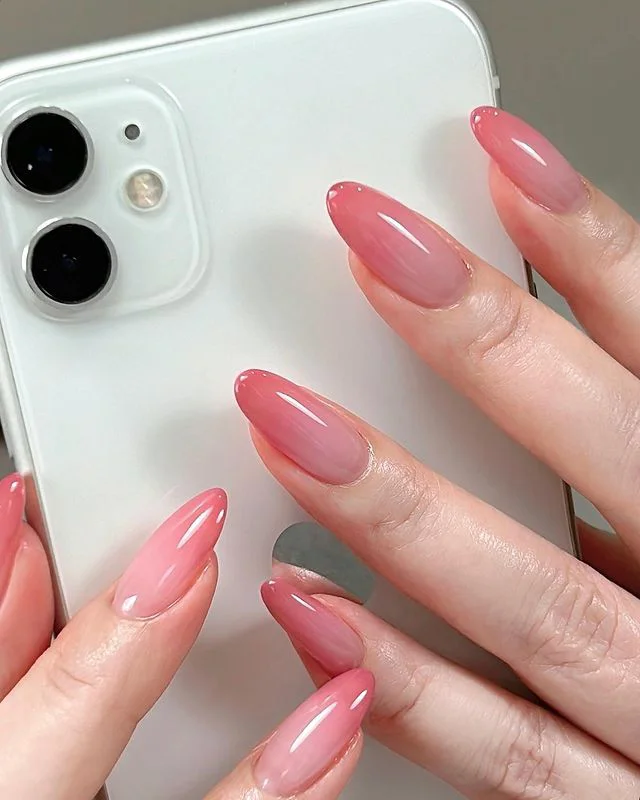 Glossy pink jelly nails, Pinterest trend.