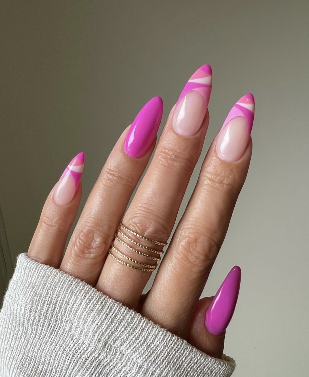 Fuchsia striped almond nails with glossy finish.
