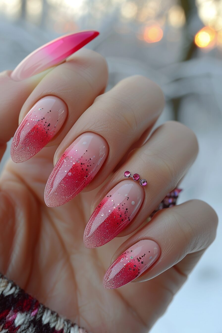 Gradient pink glitter nails with almond shape.