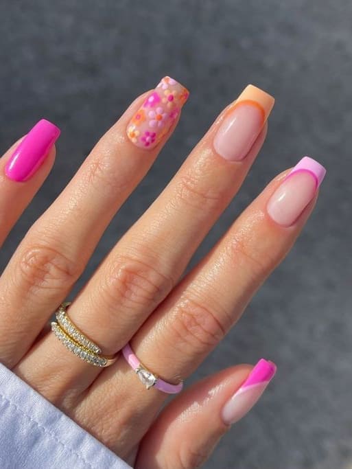 Vibrant floral and French manicure with square tips.