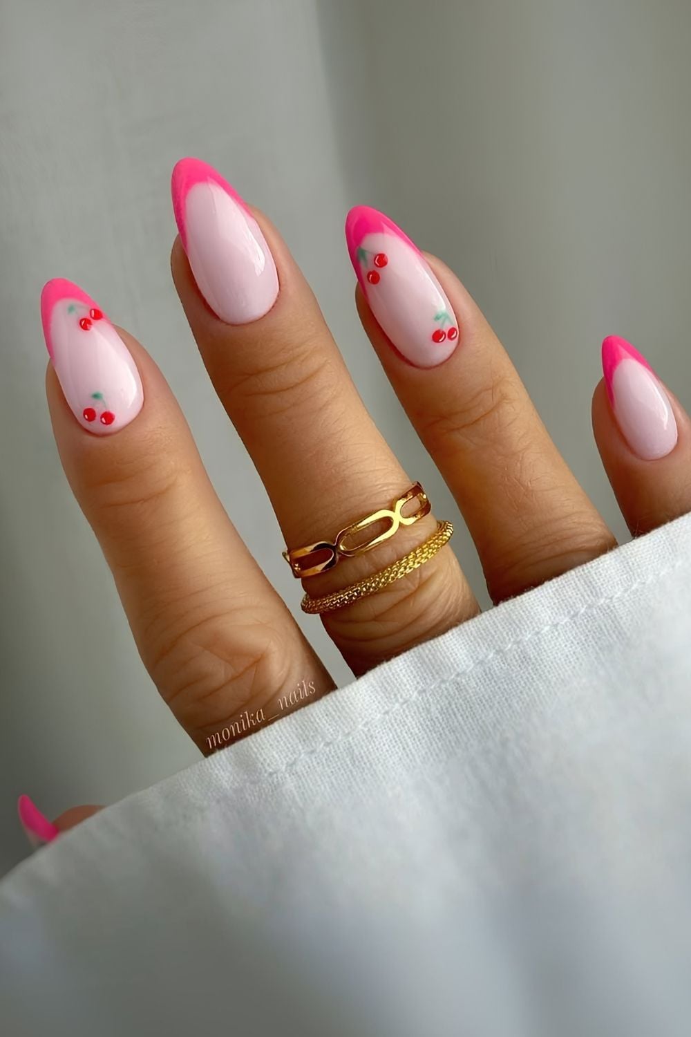 Cherry blossom pink nails with French accents.