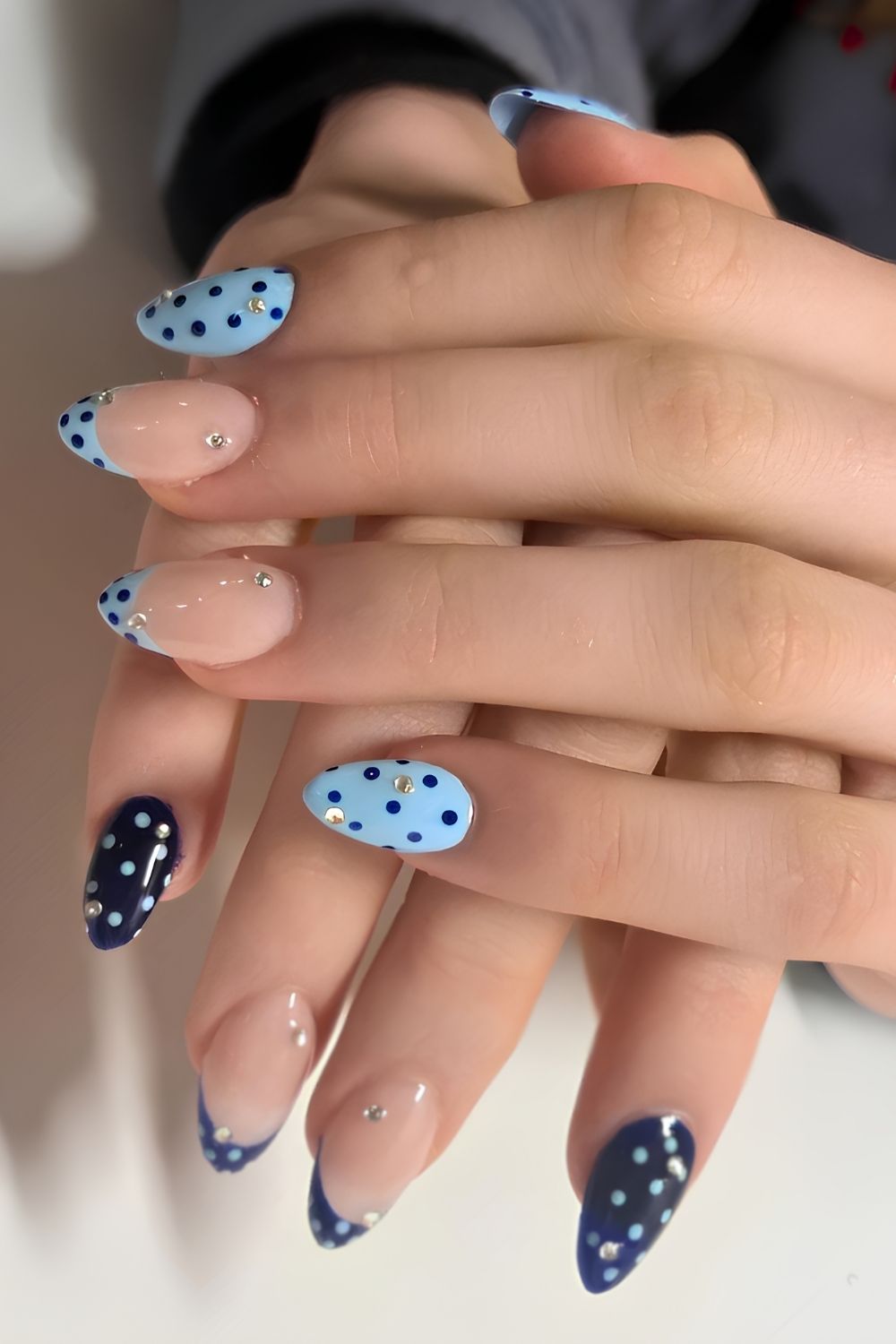 Blue gradient nails with polka dot accents, Pinterest style