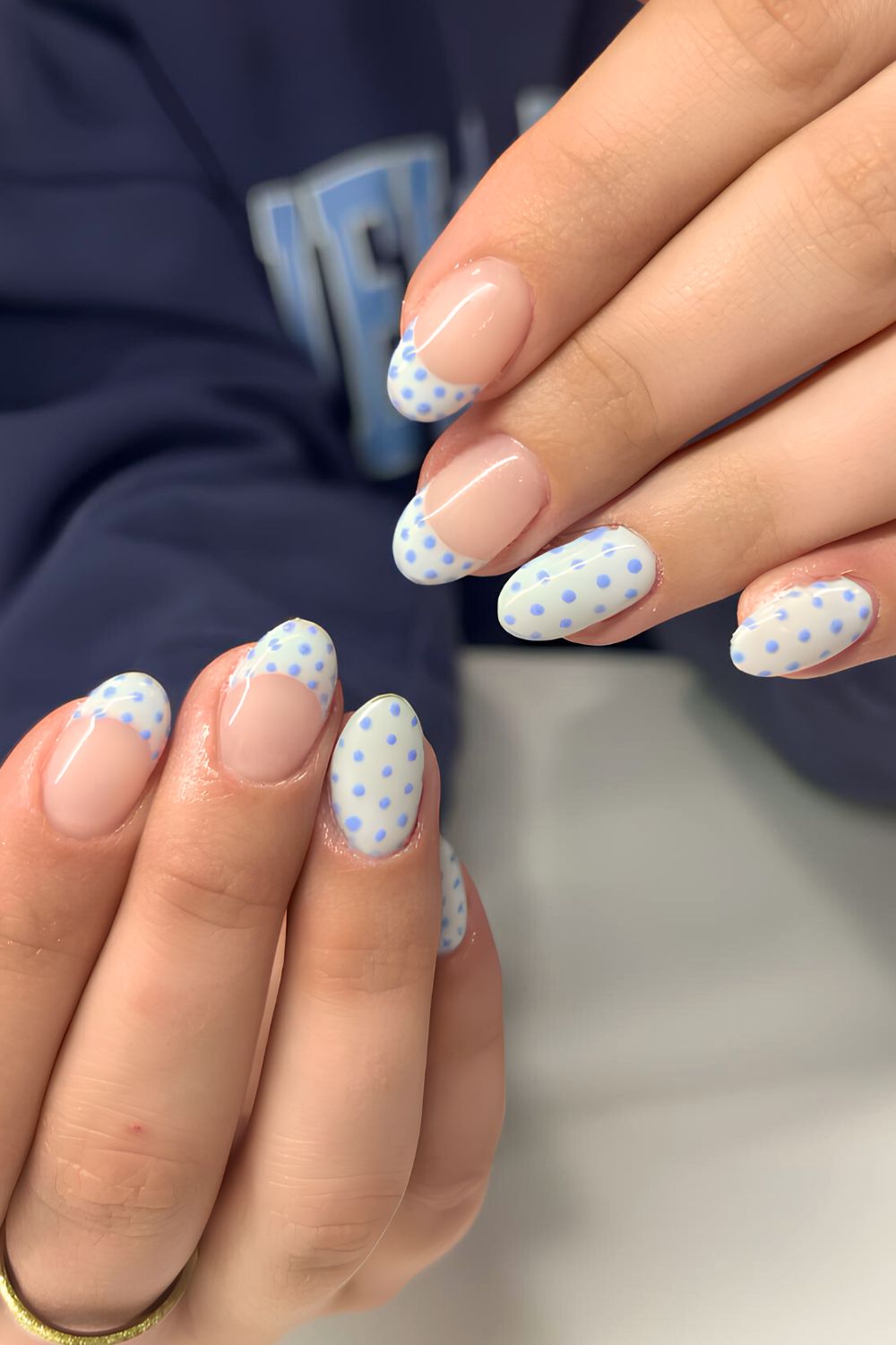 Blue polka dots on French tips