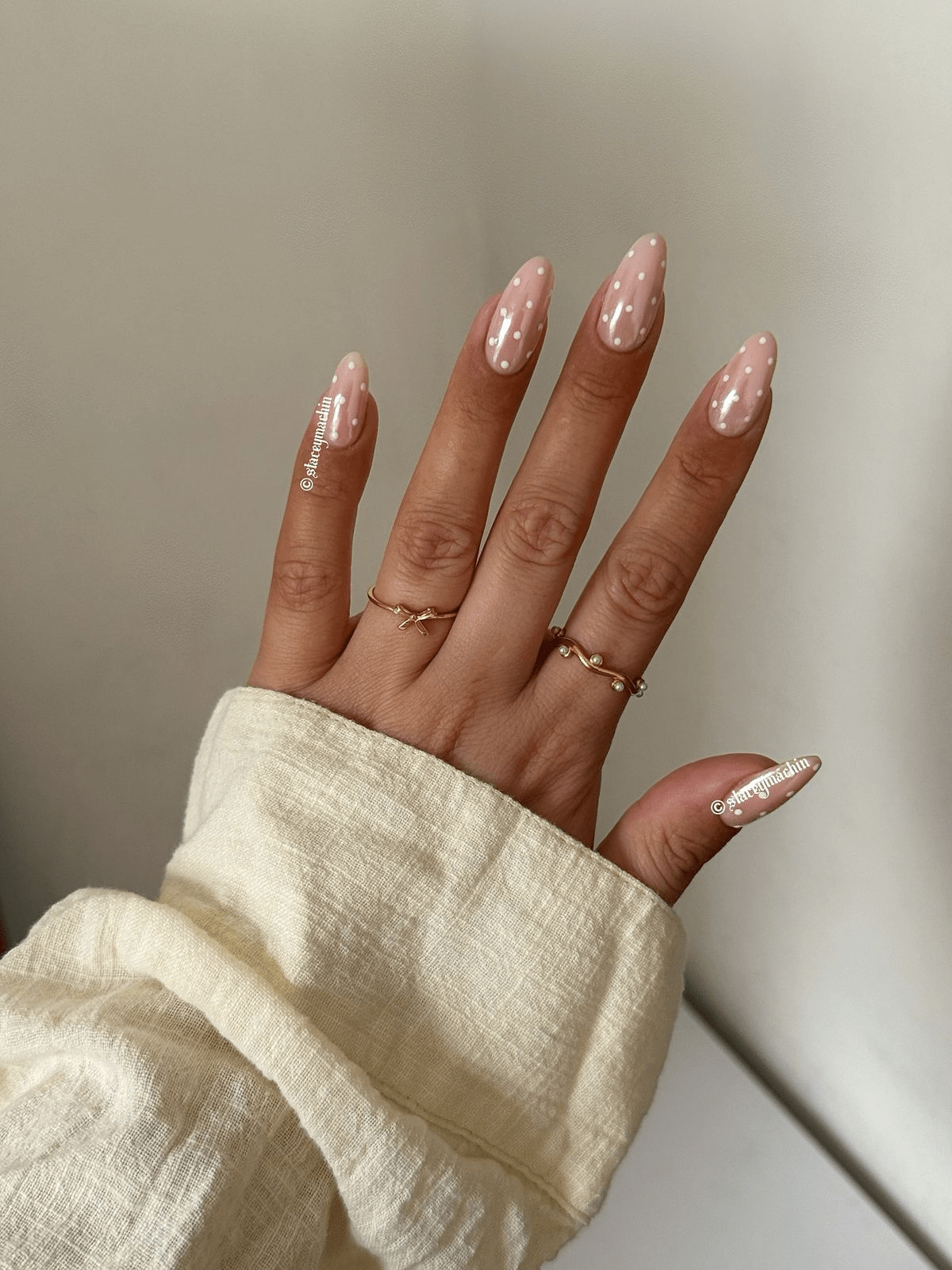Nude nails with delicate polka dots