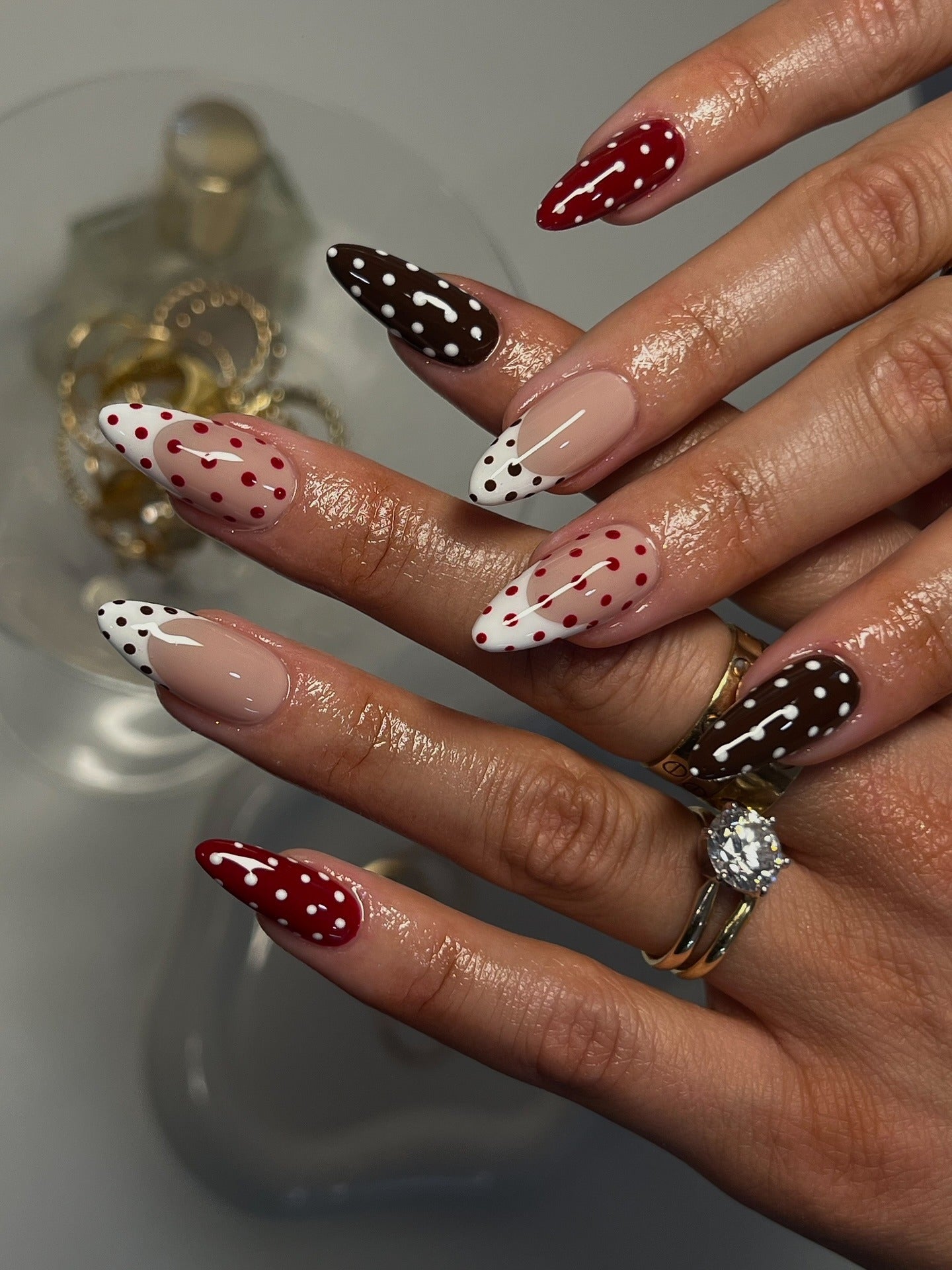 Red and brown nails with polka dots
