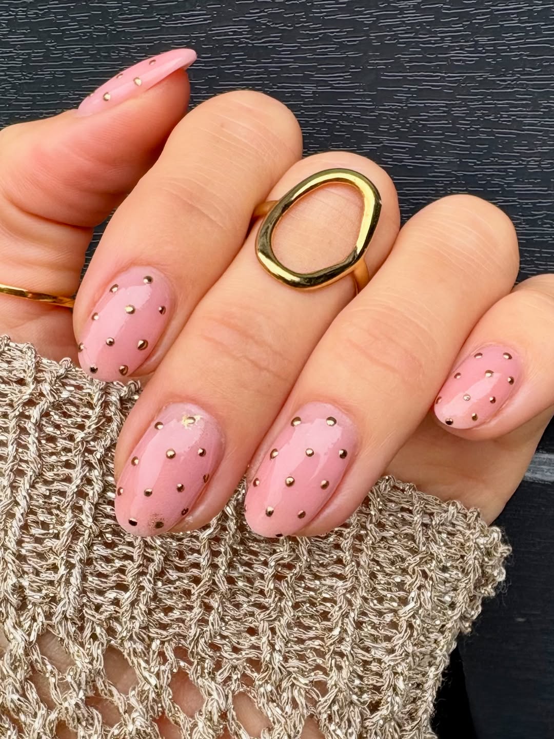 Pink nails with gold polka dots