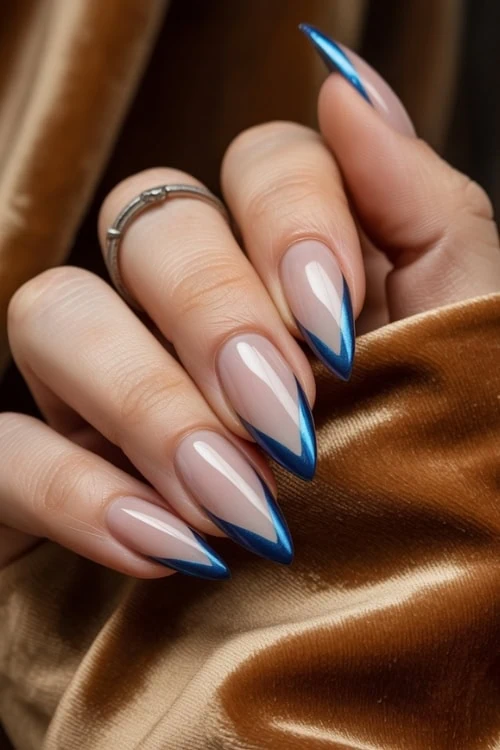 Blue French tips on almond nails, Pinterest nail trend.