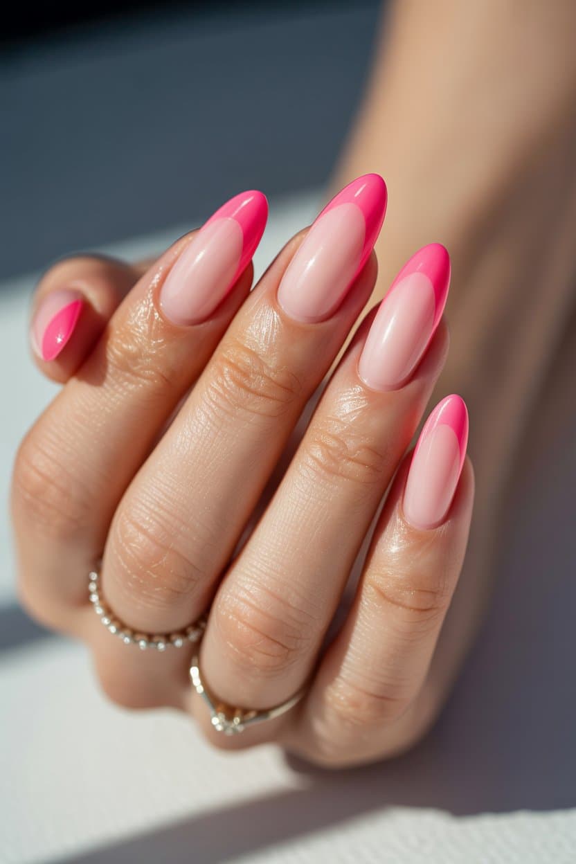 Pink French tips on almond nails, Pinterest playful manicure.