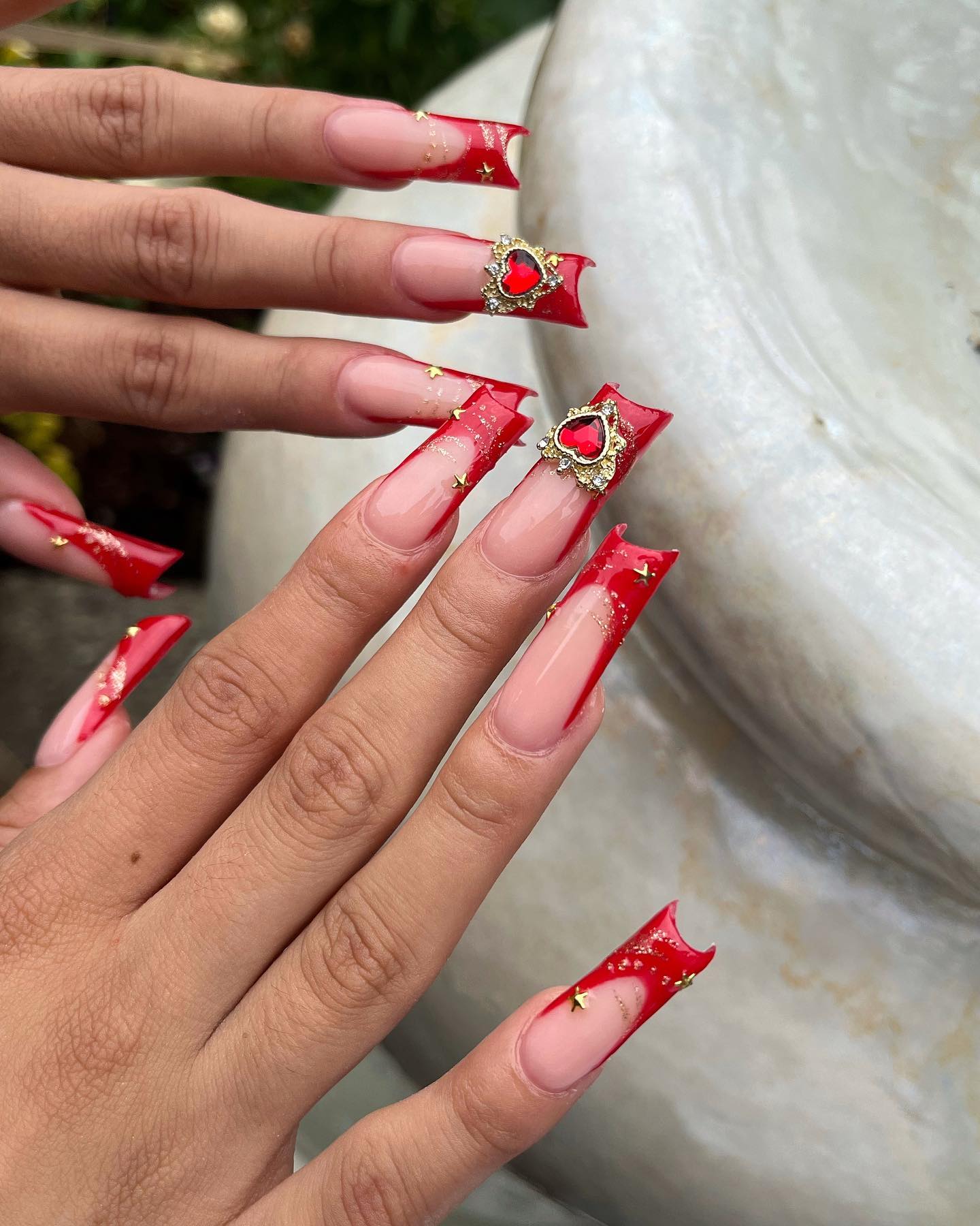 Red sculpted French tips with embellishments, Pinterest bold nails.